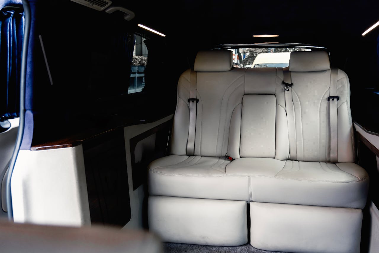Capture of a spacious and luxurious car interior featuring plush, comfortable seats perfect for travel.